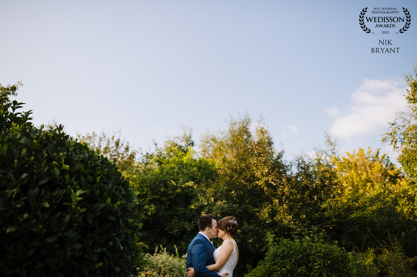 Laura and Stu in the gardens at Styal Lodge during their wedding day. I loved the contrast of the clean sky and the greenery which helped with the composition