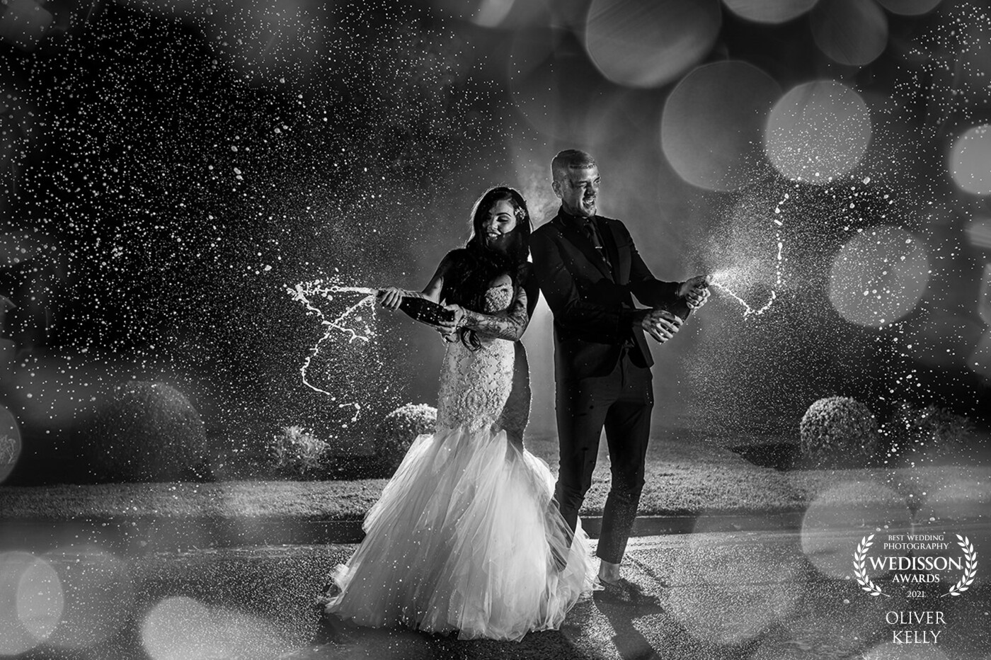 Brave the cold winter nights and put all of your trust in your wedding photographer and the results will speak for themselves! This image was taken at Mottram Hall in Cheshire using 3 Godex Ad200s to light the couple while they were absolutely loving life with the bottles of champagne!