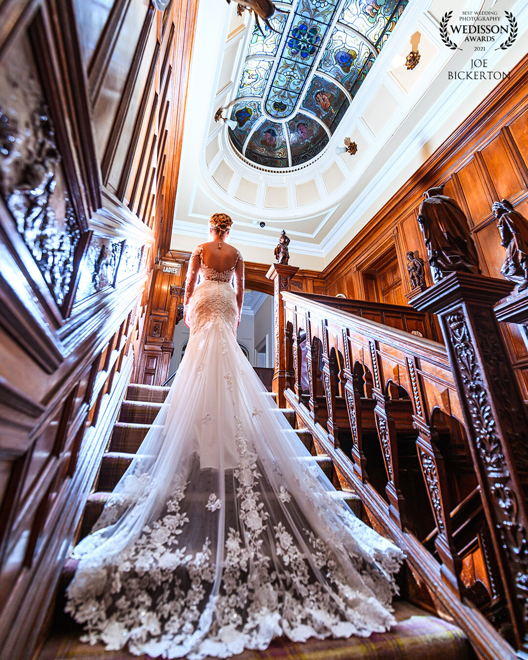 This staircase at Thornton Hall always lends itself to a 15mm wide shot.  Rachel was lit with an OCF light set at 1/64 in front of her, with a second OCF to my right at 1/128 lighting the back of the dress.  The 15mm lens was used to capture the ornate skylight and capture the flowing lines of the staircase too. Thanks for the award Wedisson!