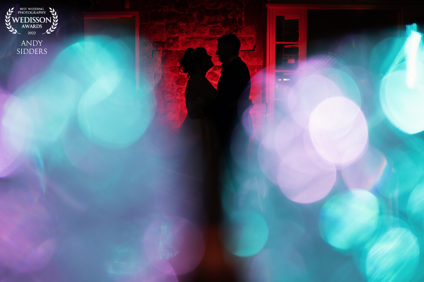 I created a silhouette of my bride and groom and created foreground interesting foreground for the image by lighting a few glass candle holders.<br />
<br />
This image was taken at Knowle Country House, in Kent.