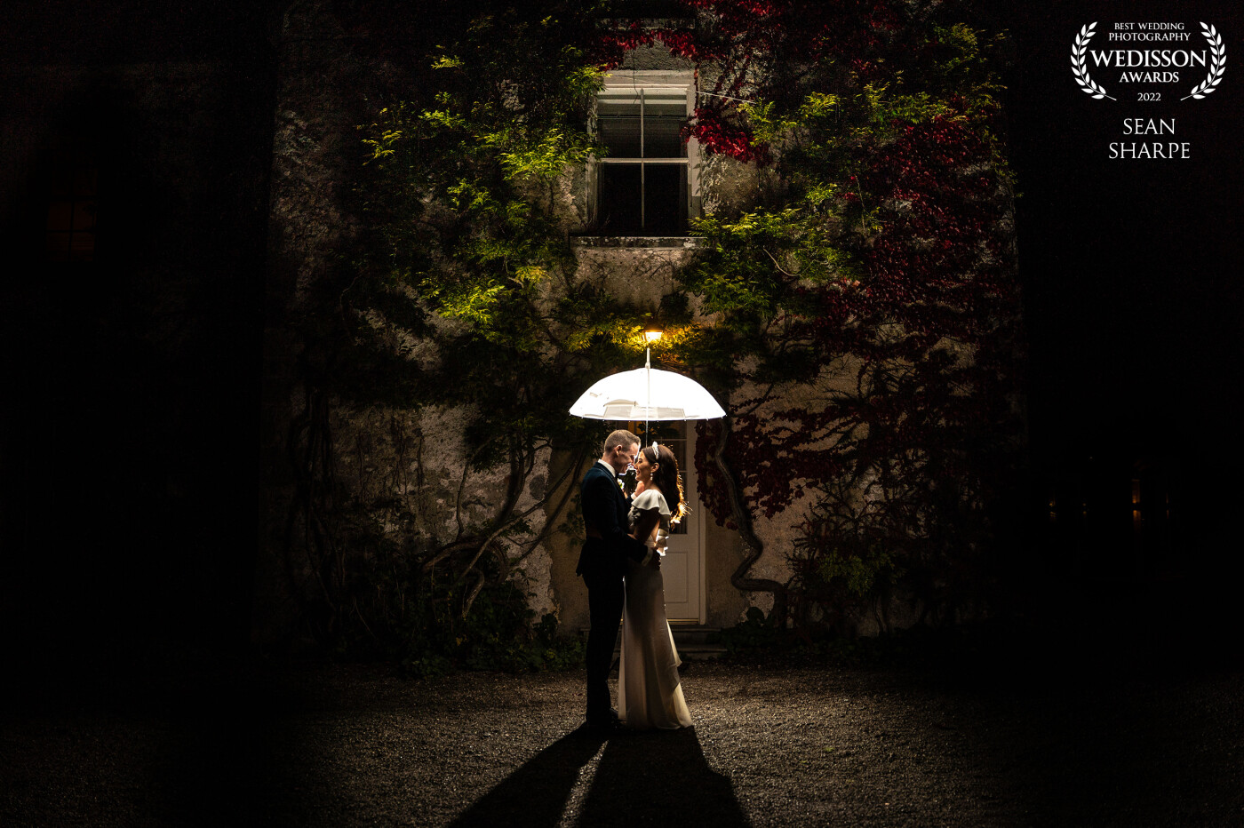 Lisa and Stephen at the beautiful Cloughjordan House, Co. Tipperary. Image taken with a flash behind the couple and using the umbrella to illuminate them. An absolutely gorgeous wedding day from start to finish.