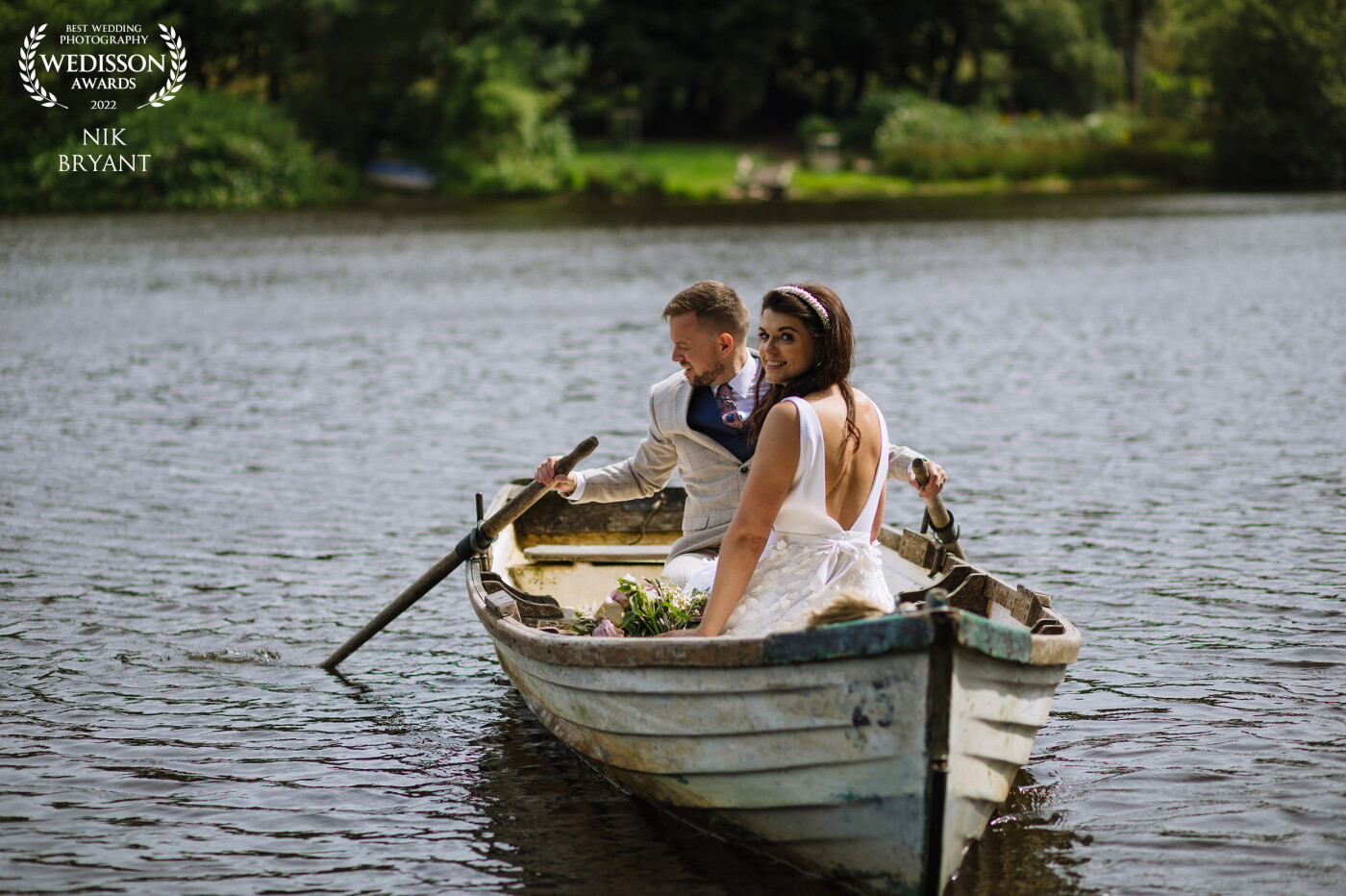 Taken on from a jetty while the bride and groom took the boat out on the lake at Wyresdale Park. I really love this shot as it took the bride some convincing to get into the boat but it was totally worth it