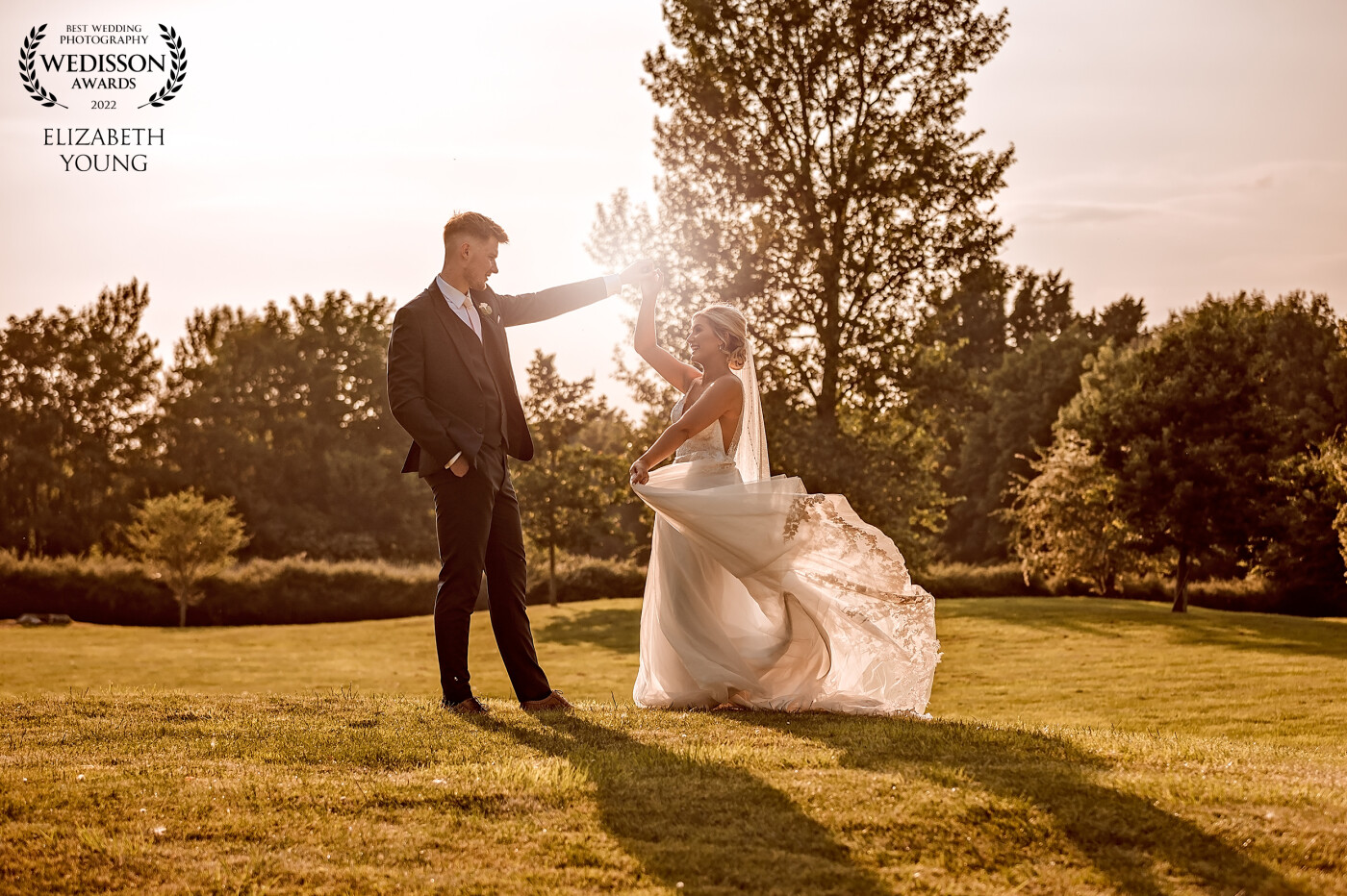 The late sun allowed for this beautiful moment for these two, they practiced their first dance away from their guests and as they did I asked the bride to swish her dress, and look at each other so I could catch the sun coming through.