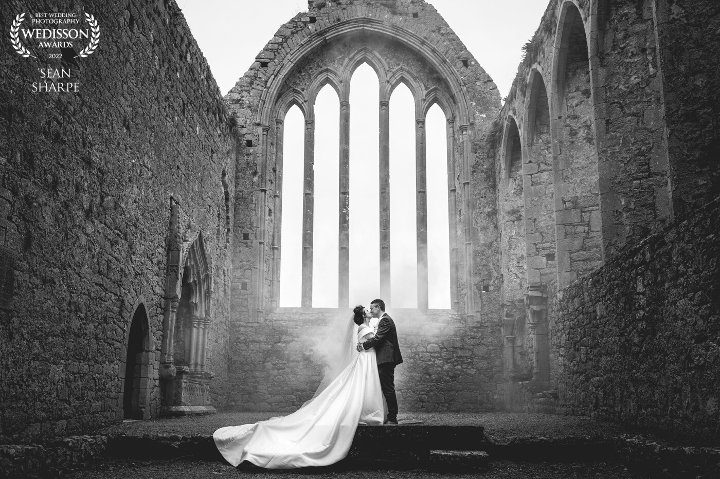 What a fantastic day with Eimear and Dave in January! Taken at the beautiful Kilmallock Abbey, Co. Limerick, shot with a white smoke bomb behind to create a light fog effect.