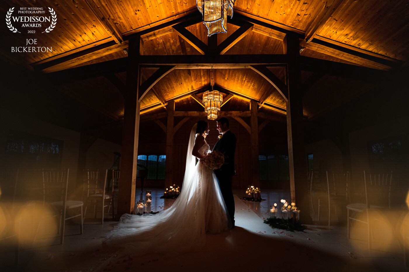 A simple OCF behind this couple at Colshaw Hall in Cheshire, England really enabled me to shoot at a low exposure revealing the intimacy of the candlelight and symmetry of the beautiful wedding barn lighting.
