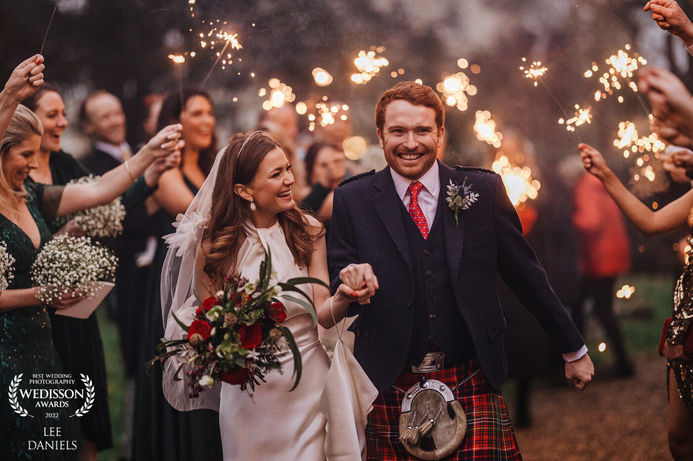 A 1500 ceremony in winter isn't what photographers really want to hear, but this sparker exit sure lit up the scene at Molly & Ross's beautiful DIY wedding
