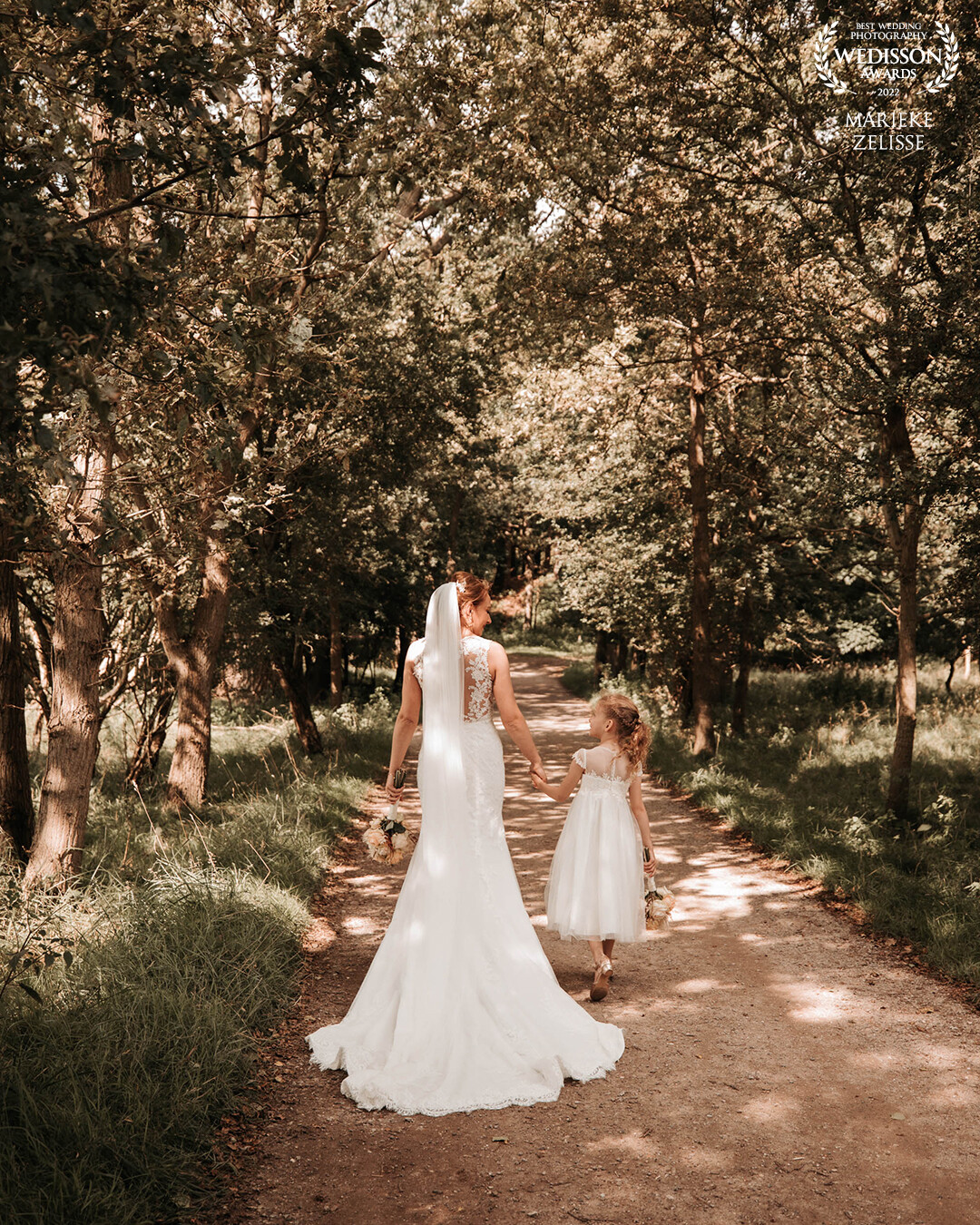 This beautiful bride with her daughter, her little bridesmaid! I love the play of the sun between the trees and the chemistry between mother & daughter.