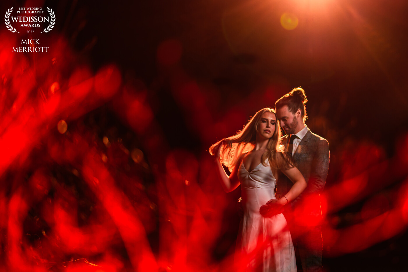This was taken on a wedding workshop with the fantastic Neil Redfern at Eaves Hall.<br />
<br />
The image was made in almost pitch black conditions outdoors utilising 3 ocf lights to light the subjects, create the sunset and light the bush in the foreground to create the bokeh with a red gel.