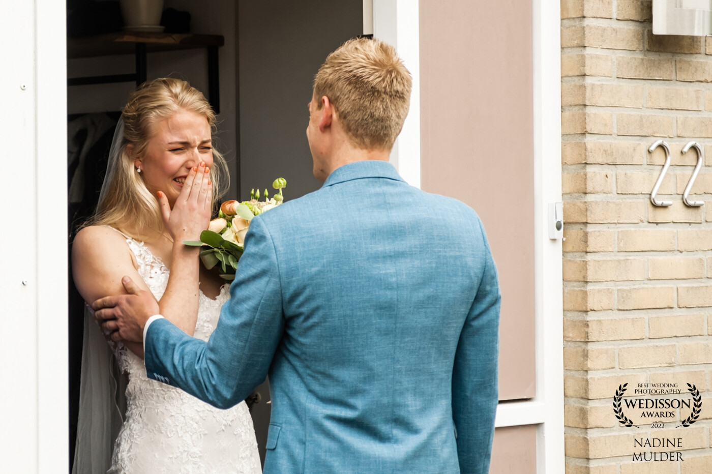 This photo was taken seconds after opening the door and having their very own first look moment! It was such an emotional en beautiful moment.  I could feel the nerves of the bride change into relieve to finally see and hold her husband to be.