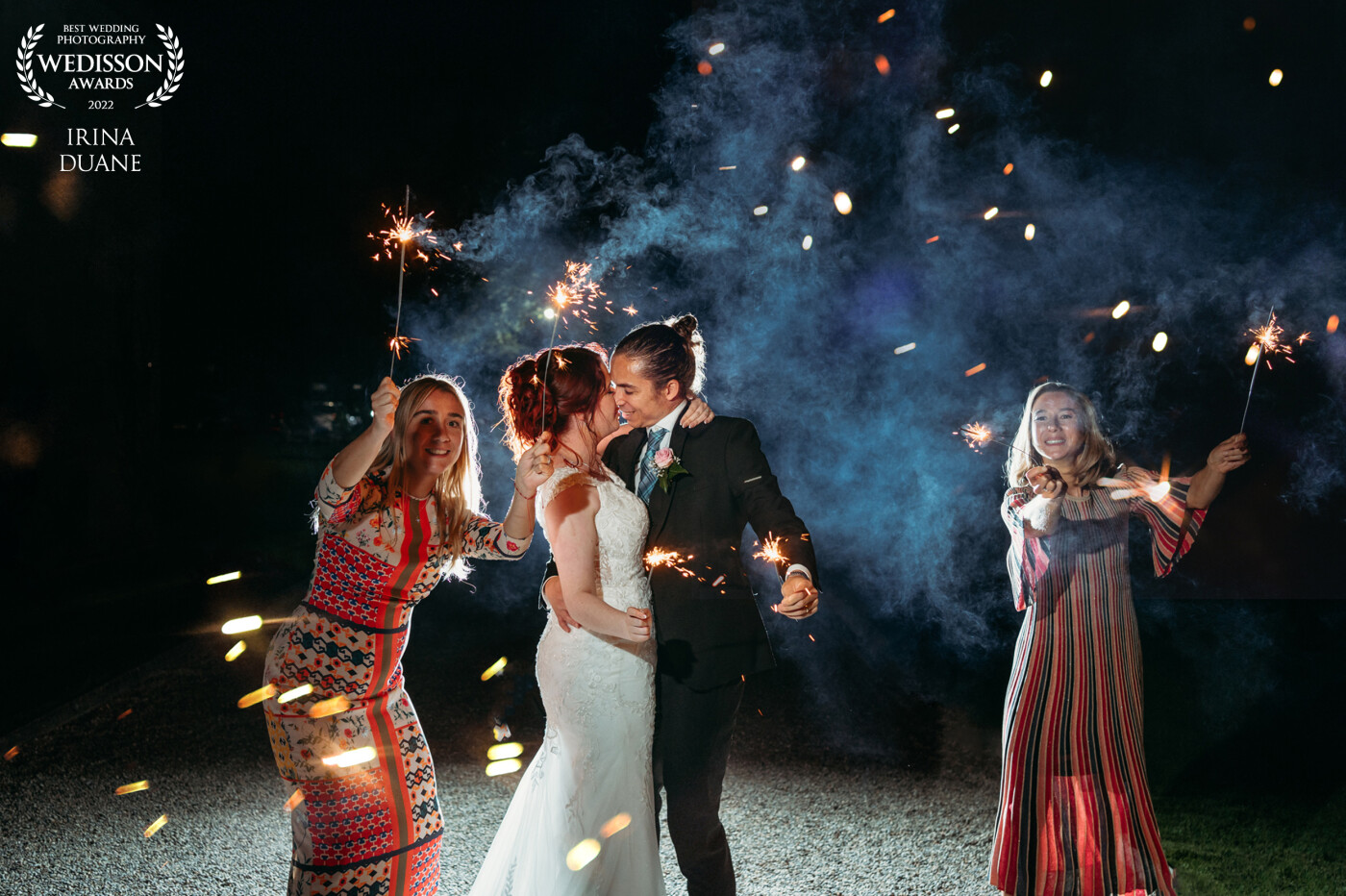 A fun ending to the wedding! Sparklers! Two flashes were used: one behind the couple with a blue gel and the camera left with a full CTO.