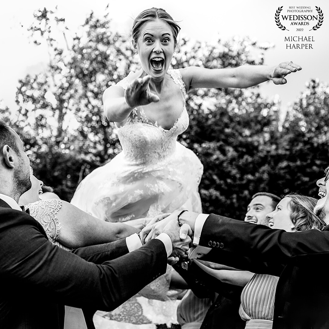 I do love a bride who is up for anything, so when she saw the groom crowd surfing she just had to have a go! shot with natural light, a high f stop and a high shutter to catch the moment that happens so so quickly!