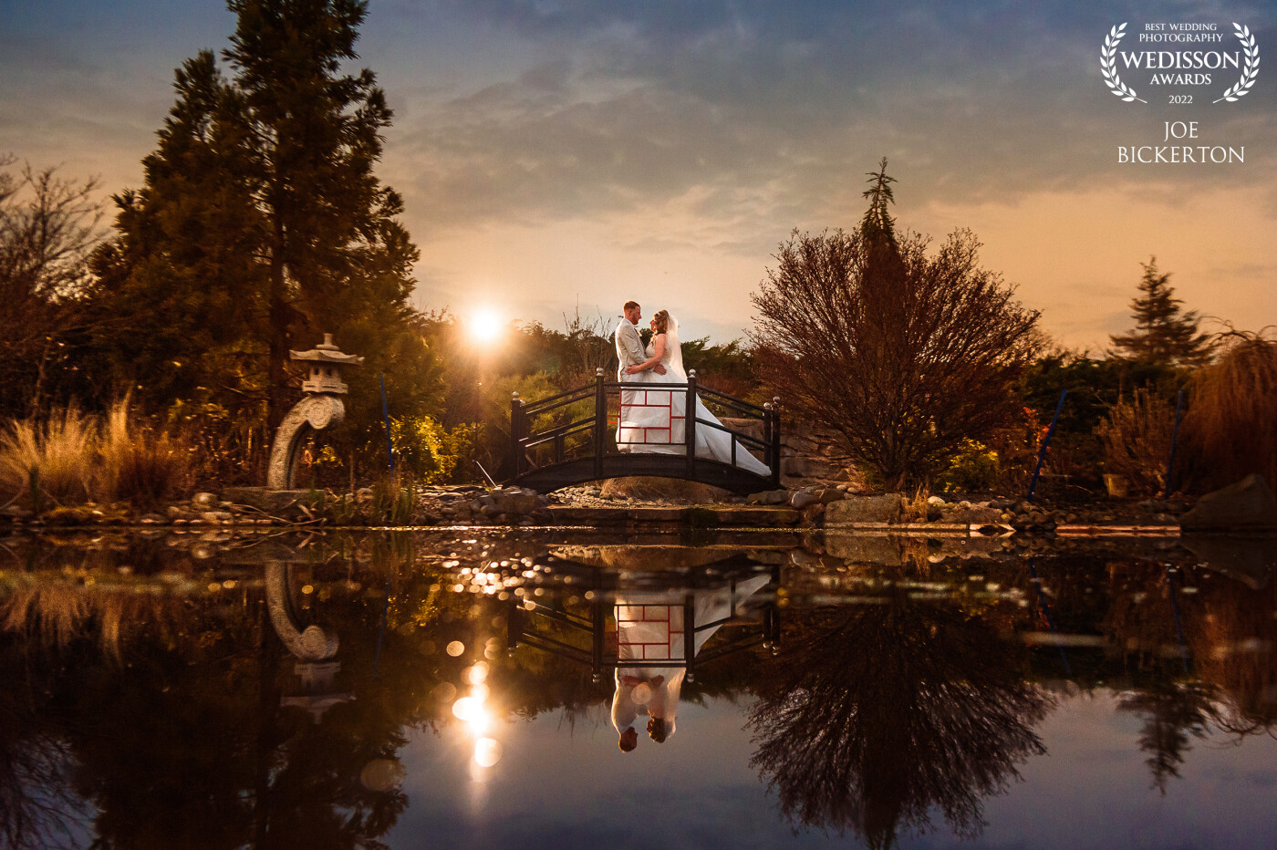 This shot at the Grosvenor Pulford in Chester, UK was taken at sunset, although as the sun had just disappeared, I used a Magmod OCF with a 1/4CTO gel to create the sun flare to the left of the couple.  I also keep the camera low to the water to create the reflection.