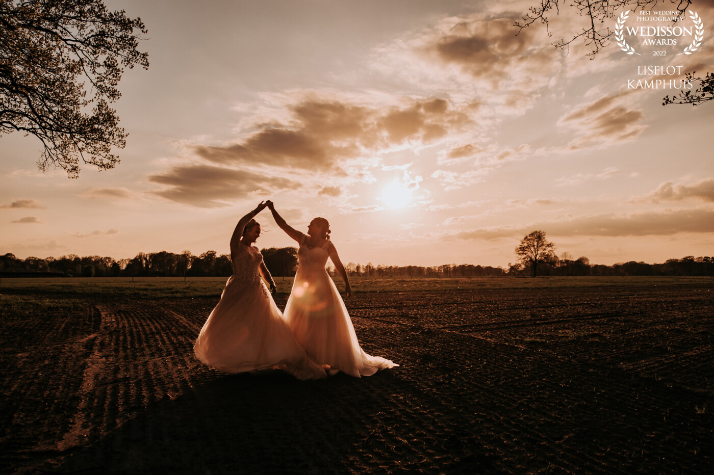These two beautiful ladies wanted to take some extra shots with golden hour. I saw this field and let them dance together and celebrate their love.