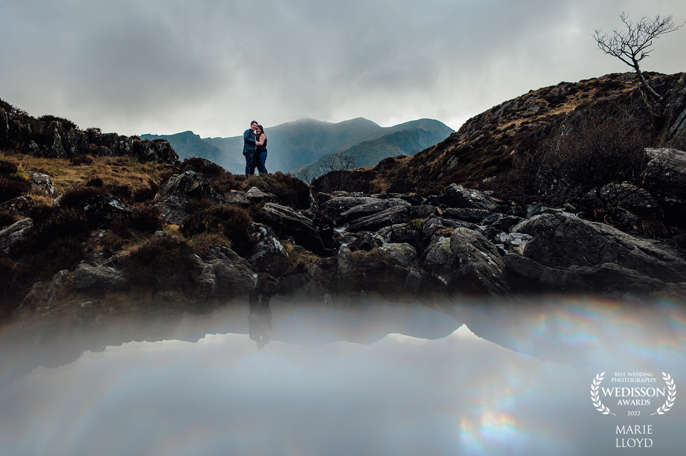 Photographed on Welsh mountains using a wide lens. A prism was used to create the reflection by holding it horizontally next to the lens.