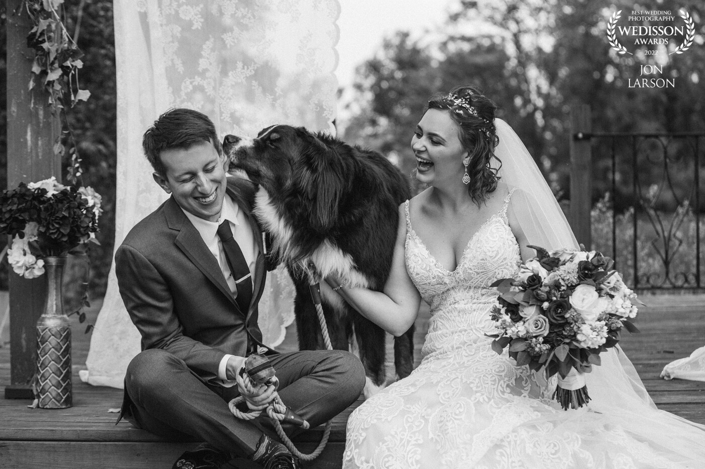 This shot took place at the alter just after ceremony. The bride and groom were sharing a moment waiting to do family formals with their dog. I kept focused on the three knowing something special was about to happen.