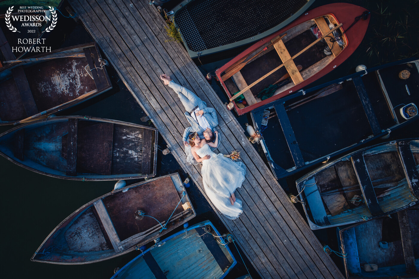 This photograph was taken on a jetty on the Norfolk Broads in England using a DJI Phantom 4 pro drone hovering above the couple.