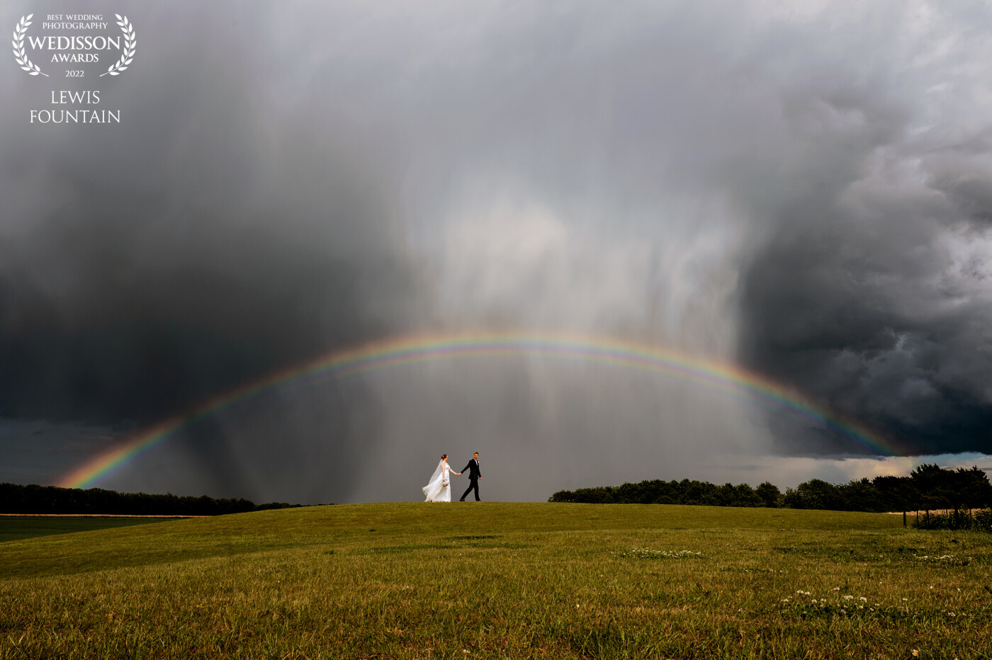 With a storm raging over Newmarket, and the sun coming out in Ely, our bride and groom were blessed with some amazing weather, and this awesome opportunity for us to get this shot at The Old Hall Ely