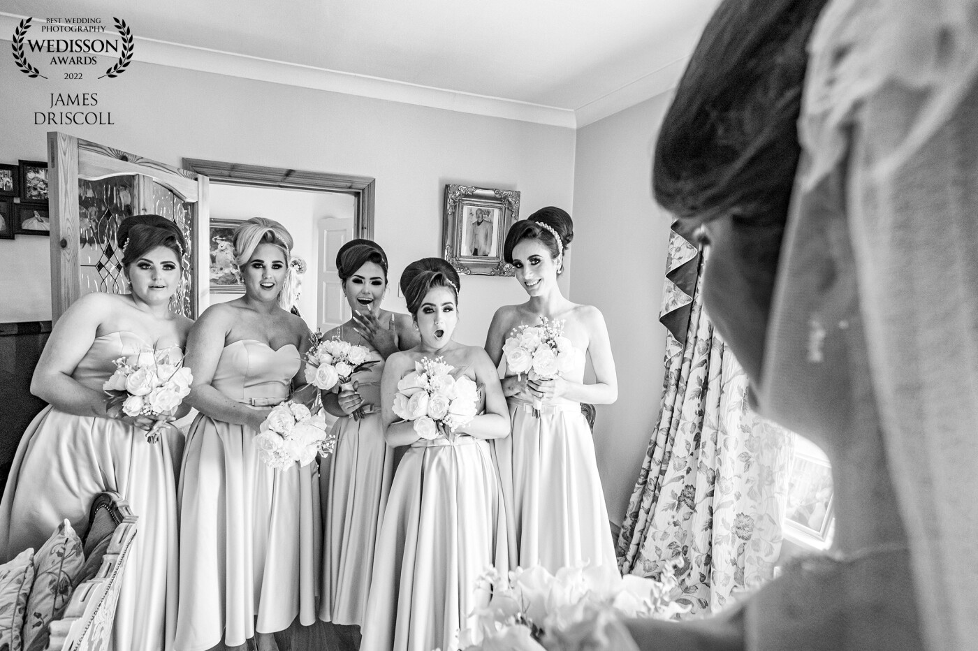 Emma had planned for her bridesmaid to walk in and she would turn around to surprise them with the wedding dress they had not seen before she turned around at that moment. Quick fire and 5 shots later somewhere in the burst of the shutter, was this reaction.. and i absolutely love it..