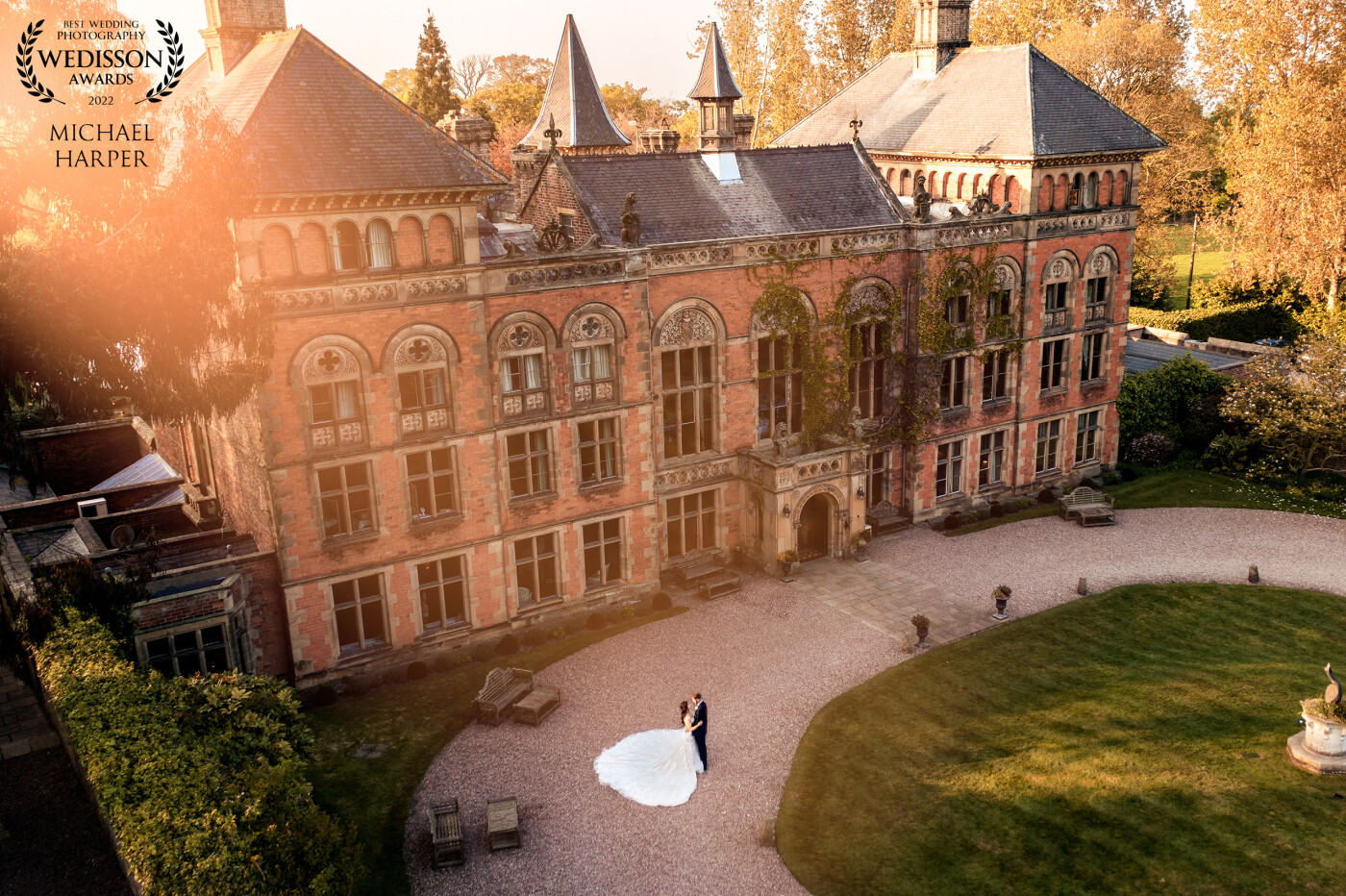 With the bride having such a big fairytale dress and the venue being a character in itself we wanted to bring these two elements together. We waited for the evening light to pass over the building to capture this amazing image by drone.