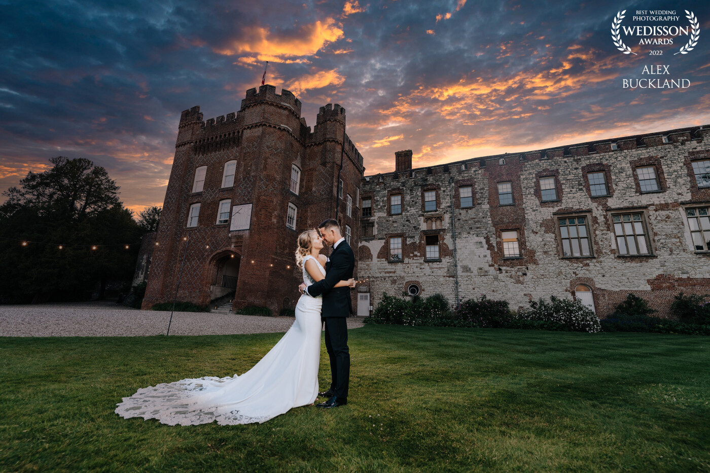 A fabulous couple and an amazing venue deserved a really creative photo! With beautiful skies as a background over this castle wedding, I lit the couple using a softbox camera right, along with one backlight to make the couple pop against the castle backdrop!