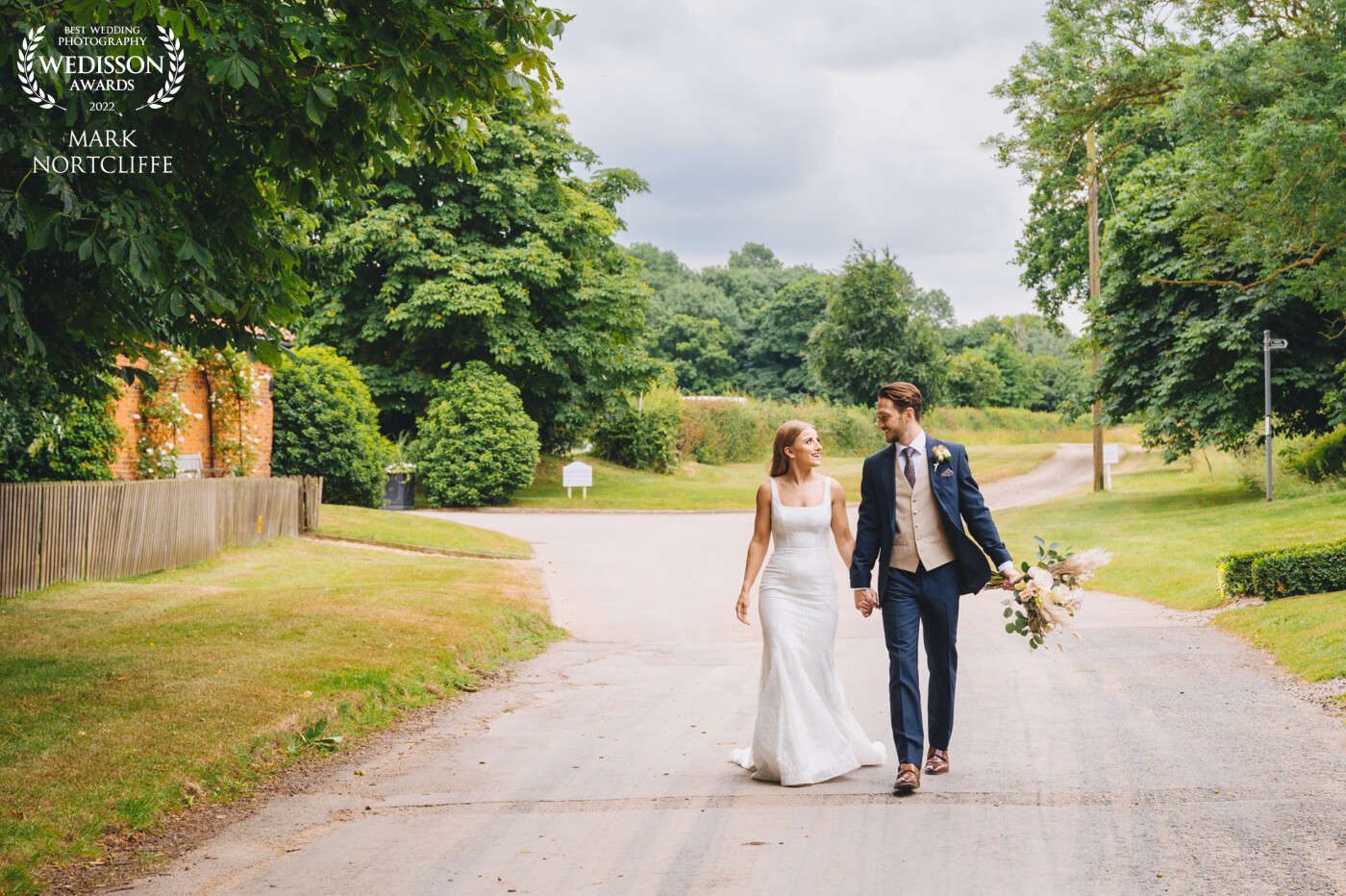 Sam & James got married at the amazing Granary Estates in Newmarket Cambridgeshire on a glorious early summer day. I love the fact James is offering to carry the bouquet. A simple semi candid moment with a couple lost in their own space.