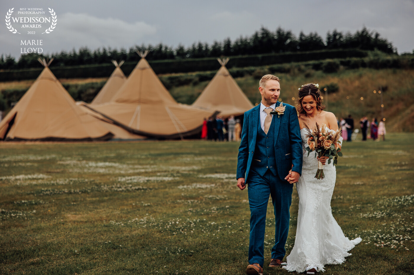 Bride and Groom taking a stroll in the gorgeous Cheshire countryside with their Tipi reception venue as a backdrop. The colours all work together so well and I love the simplicity of the photograph.
