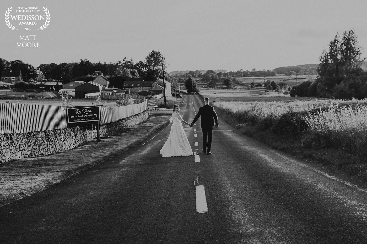 Matt and Sally enjoying a walk outside their wedding venue on the start of their new adventure together . The gorgeous couple were wed at Peak Edge Hotel in Chesterfield