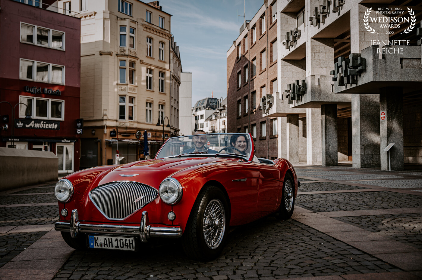 The bridal couple on their way to their wedding in the red Austin Healey. They happily reach the registry office and I was able to capture this unplanned snapshot.