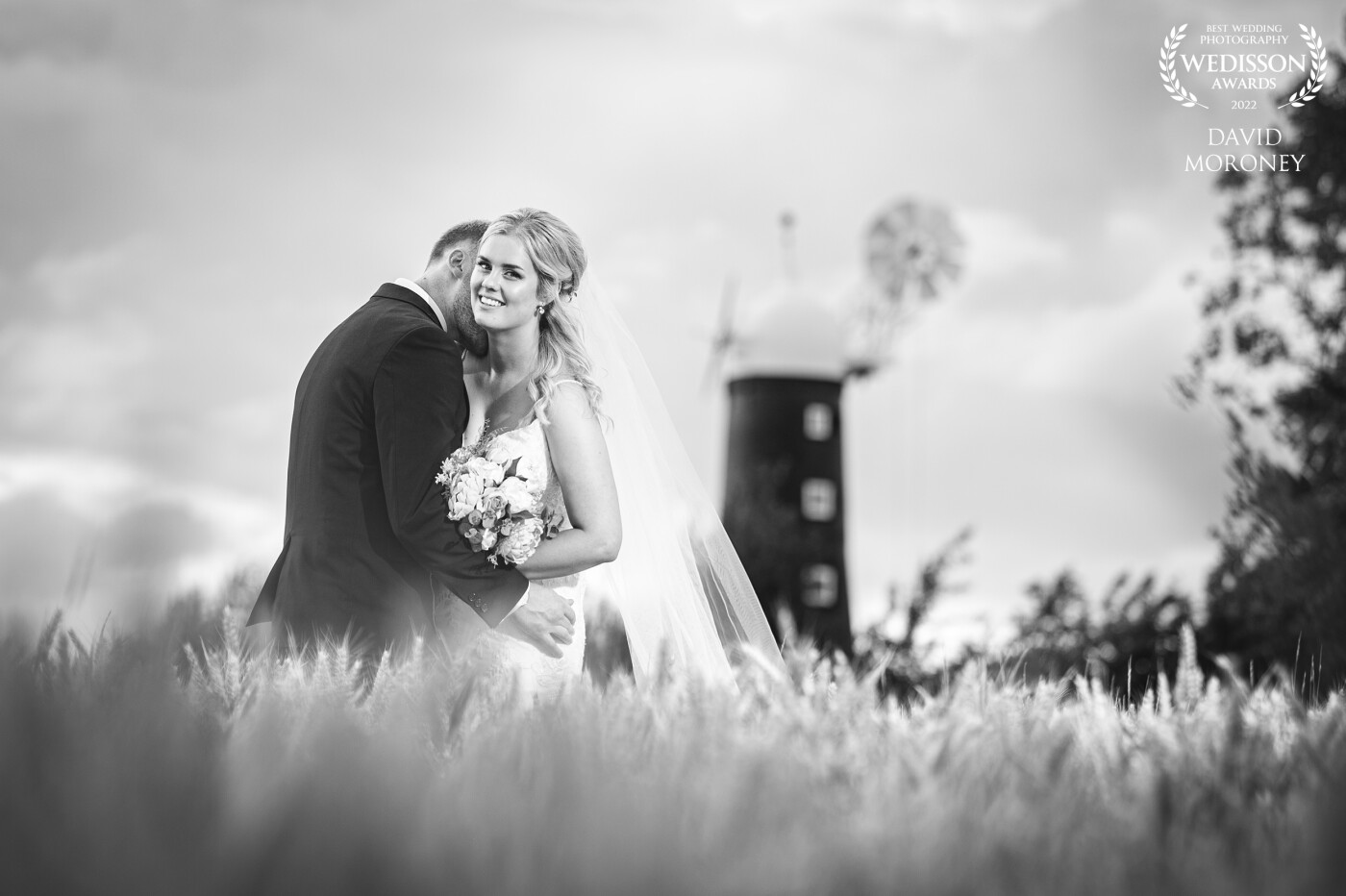 A walk through field in the evening sun, an old windmill and a beautiful bride with her handsome groom all I had to do was take the picture.