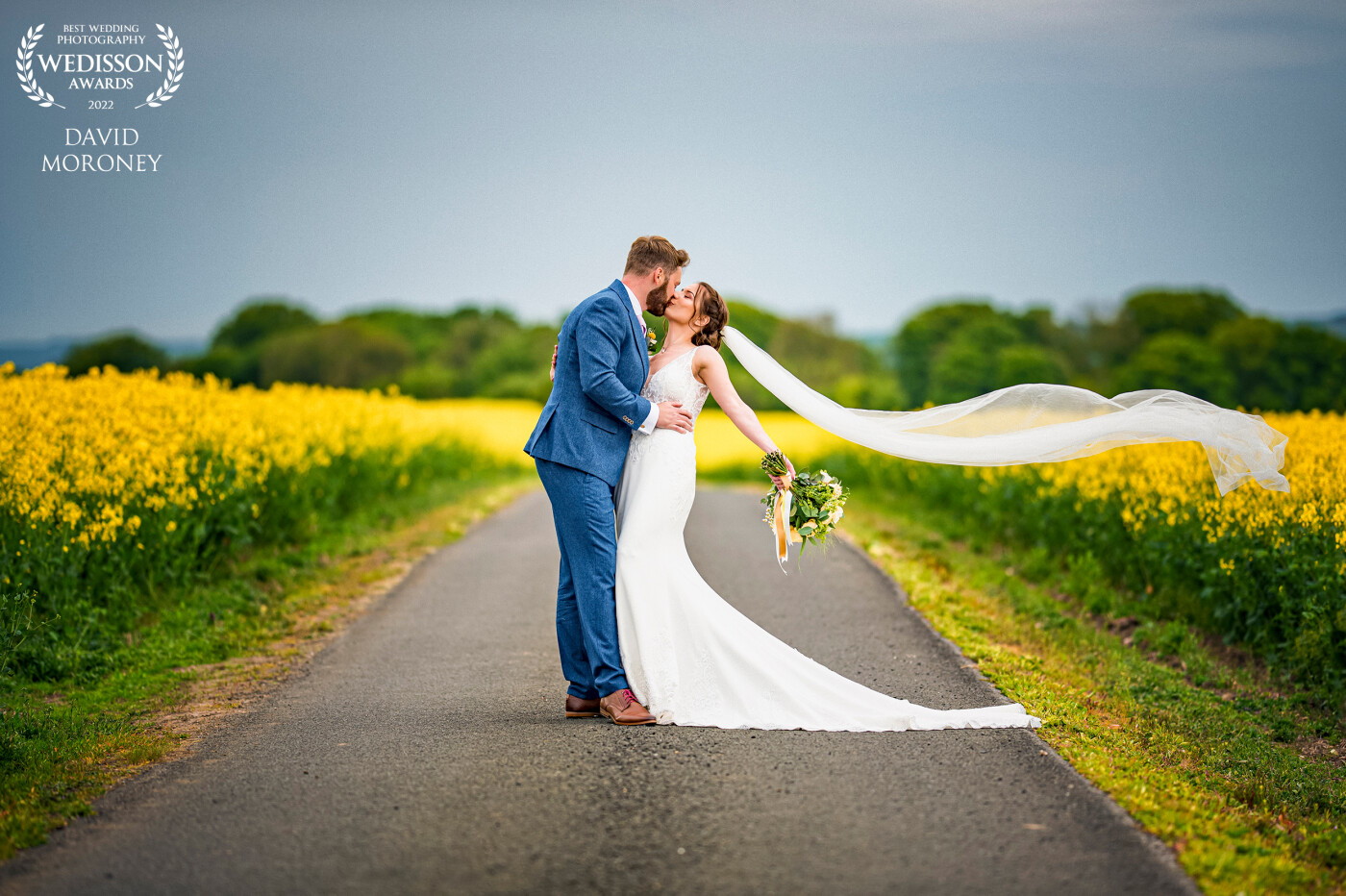 I had spotted the yellow rapeseed field on the way to venue. I was photographing bridal prep when the flowers arrived and thought what a perfect match...