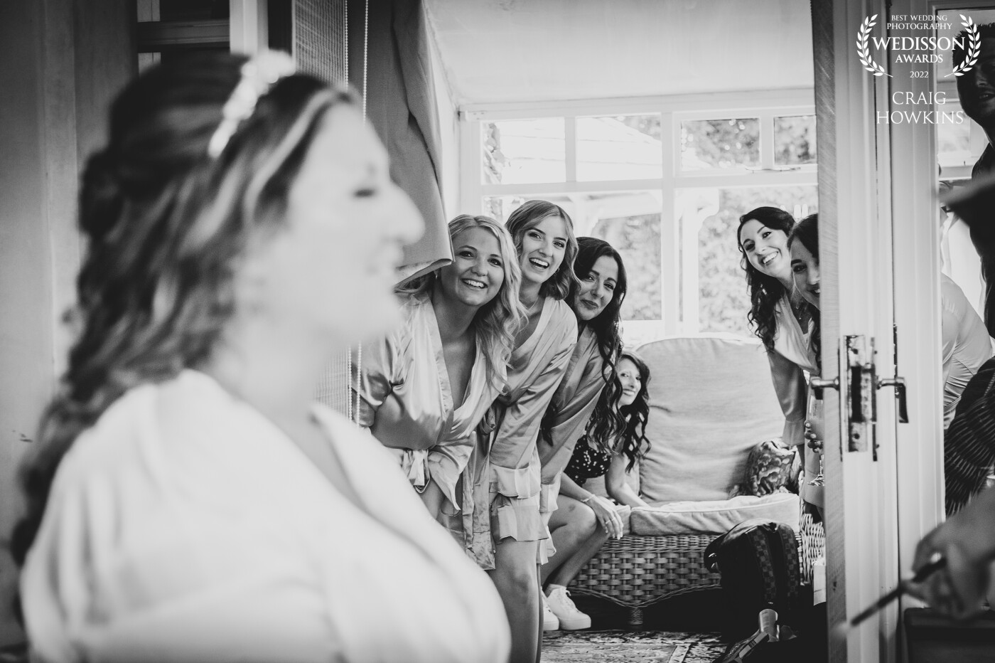 I love it when a moment just happens naturally. This shot was not staged. .As I was doing the bridal prep shoot, the bridesmaids wanted a quick look at the bride so they all just gathered around and made this shot work. That's what I call being in the right place at the right time.