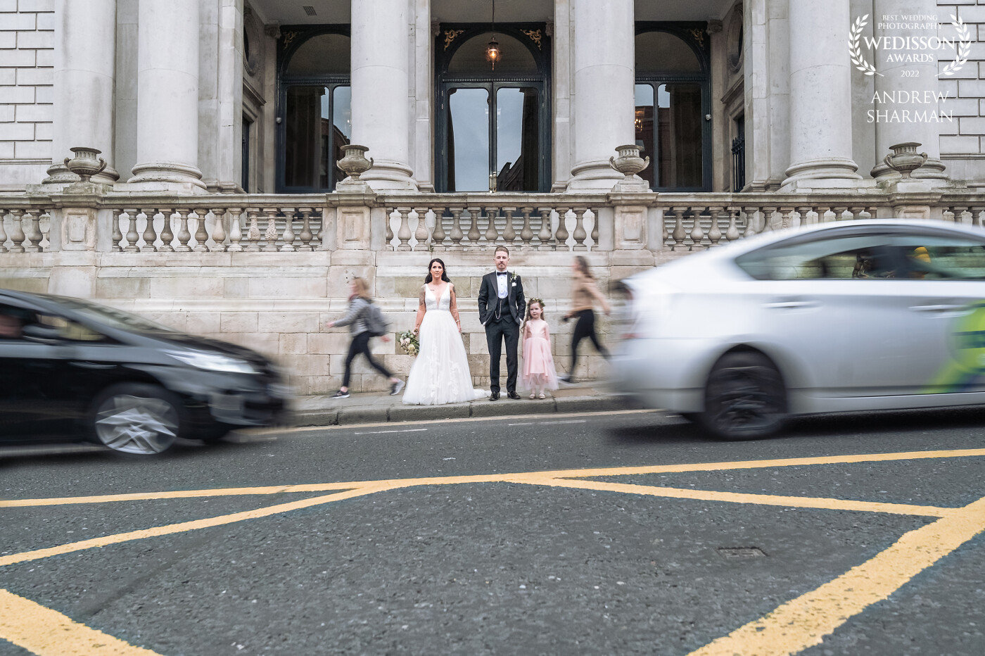 Rob and Jen's Dublin city wedding at City hall, I wanted to show how timeless this couples love for each other and their 6 year old daughter Erin is by using some shutter drag and slowing traffic and people passing by in the shot, definitely one of my favorites from their day :)