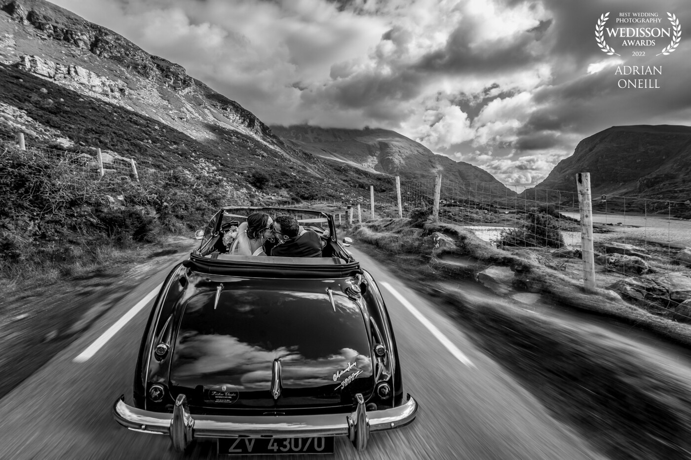 Driving through the Gap of Dunloe in Kerry, Ireland.  The groom took his eyes off the road for a cheeky kiss....what a background, what a couple, what a day....It's a great job we have.