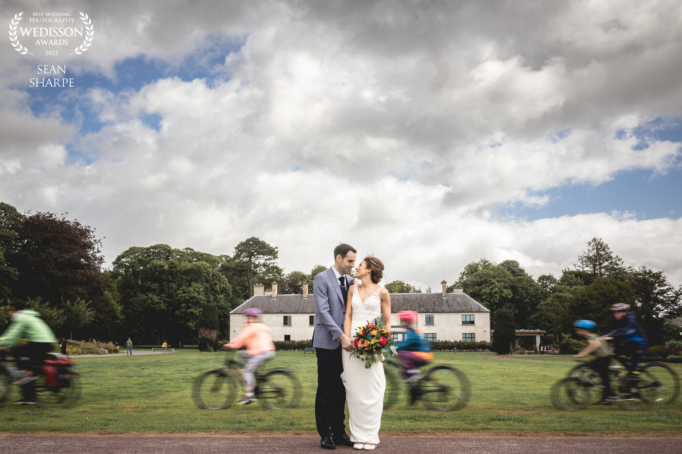 Taken in the grounds of Killarney House and Gardens, Anita and Eoghan were just brilliant to work with on their wedding day. For this shot, I made a random family of cyclists go passed repeatedly until we got it right for that motion blur effect.