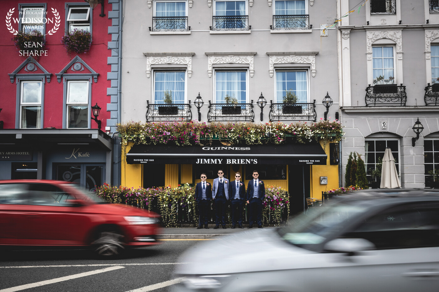 A traditional pint before the wedding with your groomsmen. This shot took a few attempts to get the cars to line up with the guys but always worth the effort.