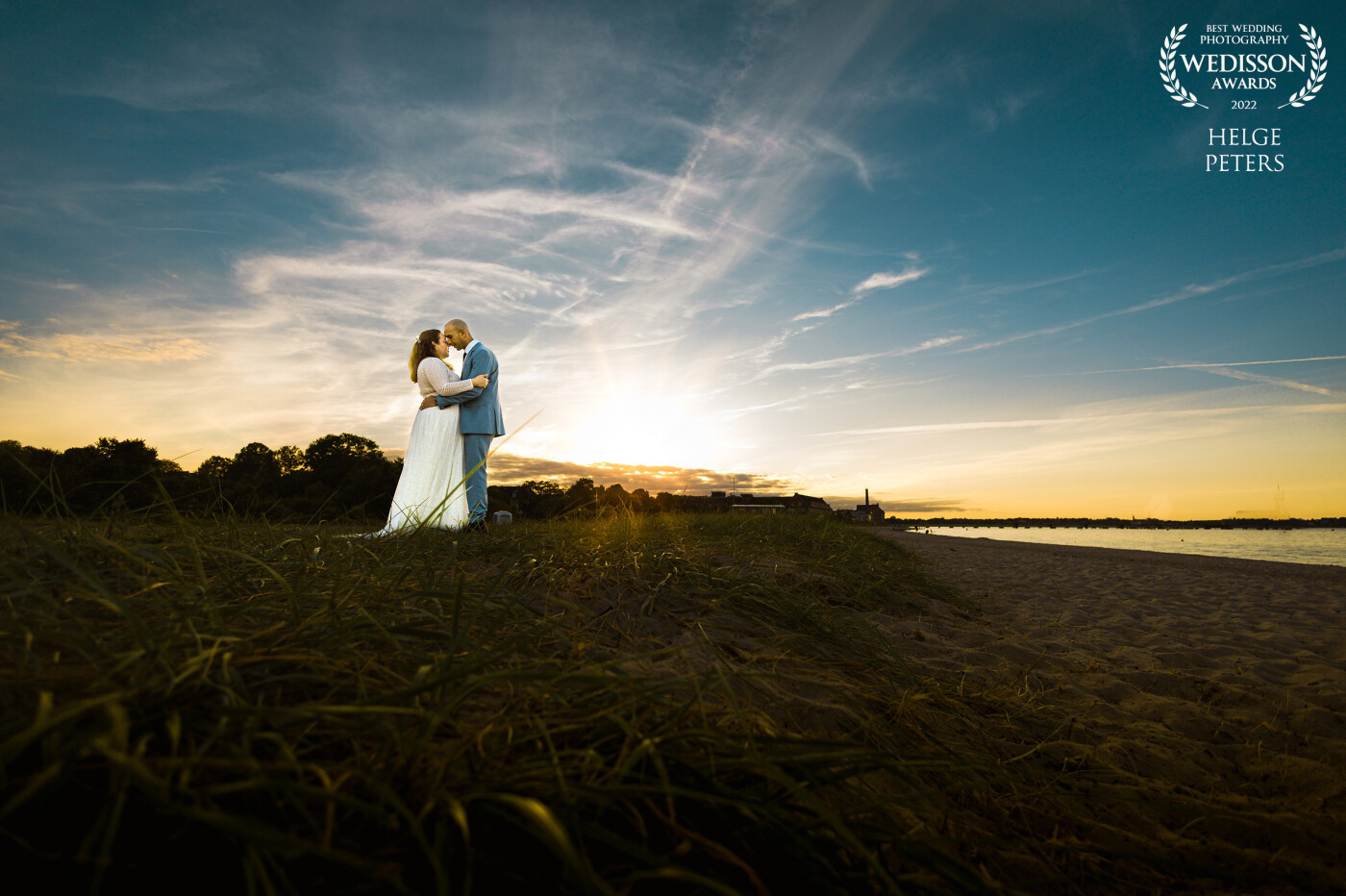 I love to do the couple shoots of a wedding in the golden hour. Living on the beach in northern Gernany, we have several perfekt locations near Eckernförde. Often I'll use an of camera flash to expose the couple in an underexposed enviromental picture directed against the sun. Thank you from the bottom of my heart for this award!