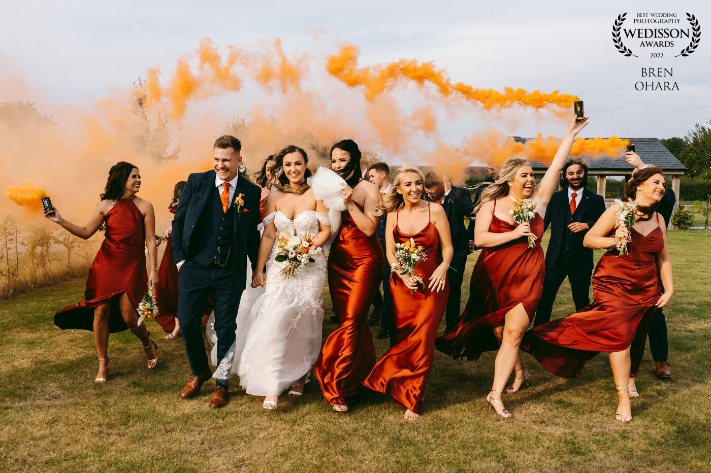Taken at the wedding of Tia and Jake. The wedding was held at one of my favourite venues, The Beverley Barn. With smoke grenades I just never know how it will turn out, thankfully this wedding party were up for anything! We ended up practically running around a field. Orange was the colour theme for the wedding, so the orange grenades were quite appropriate.