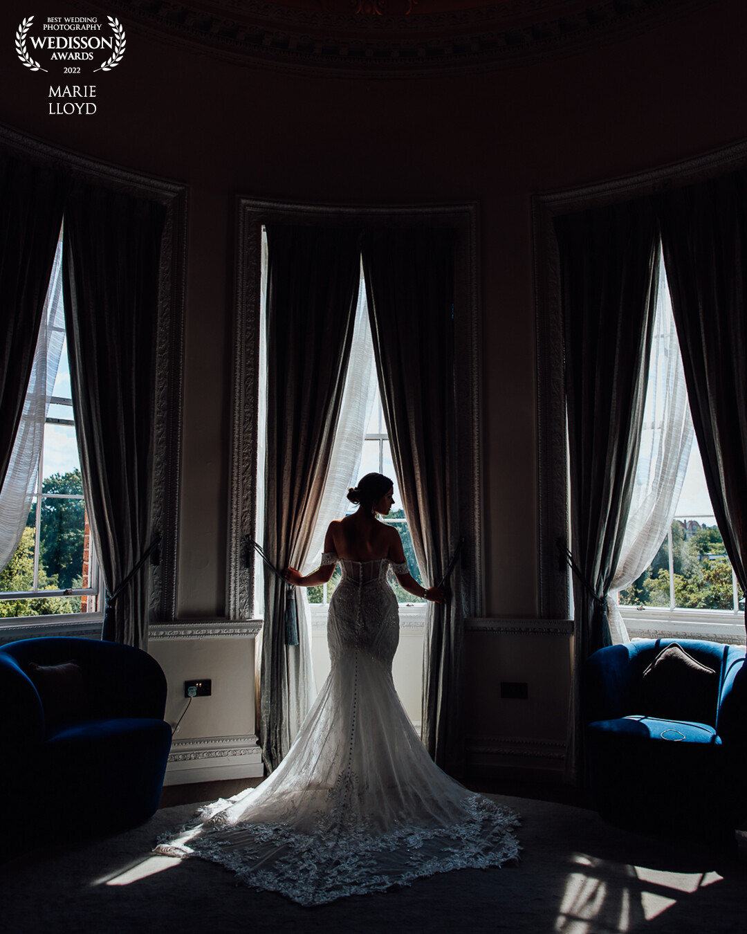 The window was used as a frame to get the bride's silhouette, the dress was fluffed out and the head was in a side profile to maximise the silhouette.