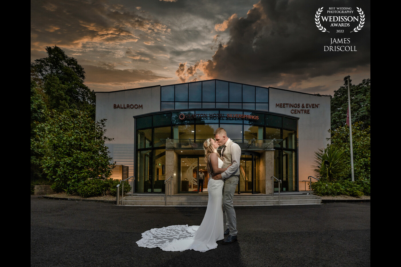 Sliversprings Cork, Graeme & Danielle,  the evening was wearing on and everyone had sat down to eat, when i walked outside and turned back and looked at the venue, saw a beautiful sunset so ran and grabbed my bride and groom for like 3 minutes.  They put forks down and followed me out and this was the outcome. One flash behind and one in front..