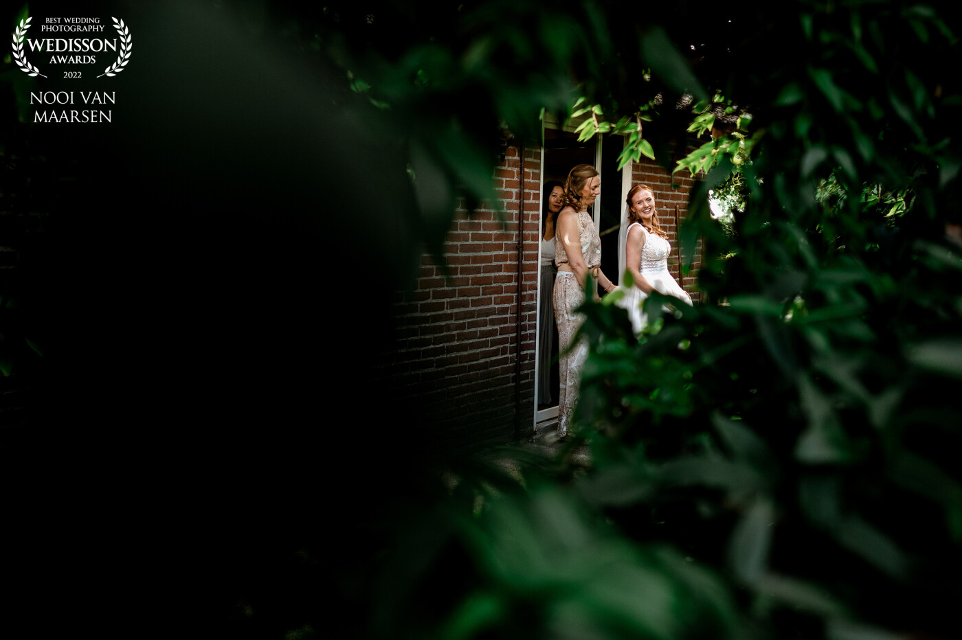 This moment was captured right before the first look at the Bed and Breakfast Mon Chouette in Leusden, the Netherlands. <br />
I positioned the groom at an open area and went to see where the bride was at. At that moment she walked outside the door and I called her name and caught her attention.