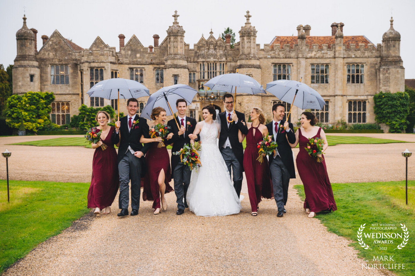 Diana & Dan's amazing wedding at the suitably awesome Hengrave Hall in Suffolk. Who said rains dampens the spirits on a wedding day? Besides it said to be good luck if it rains on your wedding day! If my couples are up for it I'm there with my camera. I love it when my couples embrace whatever the day throws at them. Pictures like this make the day more memorable. Thank you guys.
