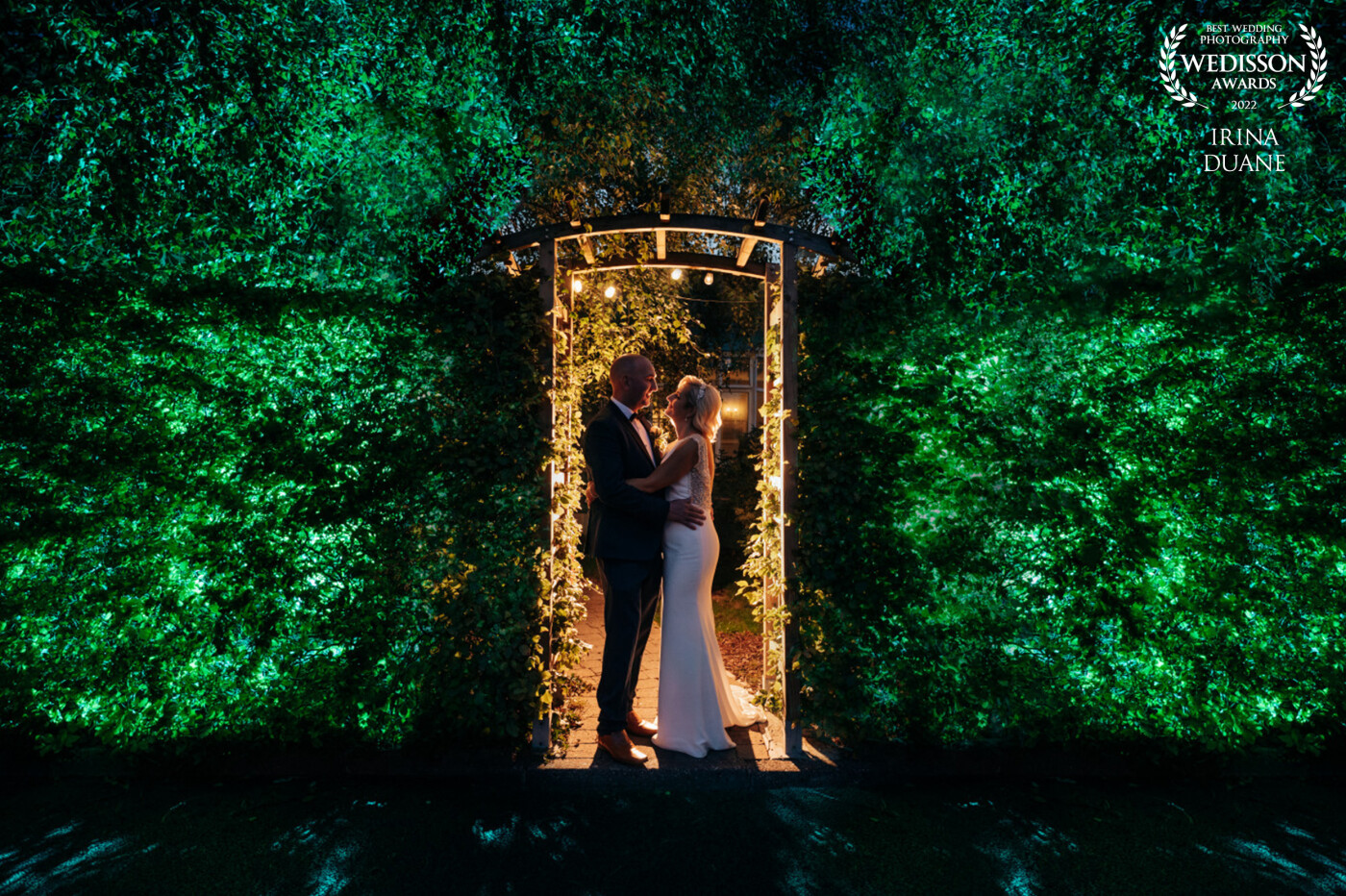 This image came at the end of the day at the Park Hotel Dungarvan, Ireland.  Godox ad200 with MagMod Sphere and green MagGel behind the bushes at full power. Godox v860iii with full CTO behind the couple for a warm back light.
