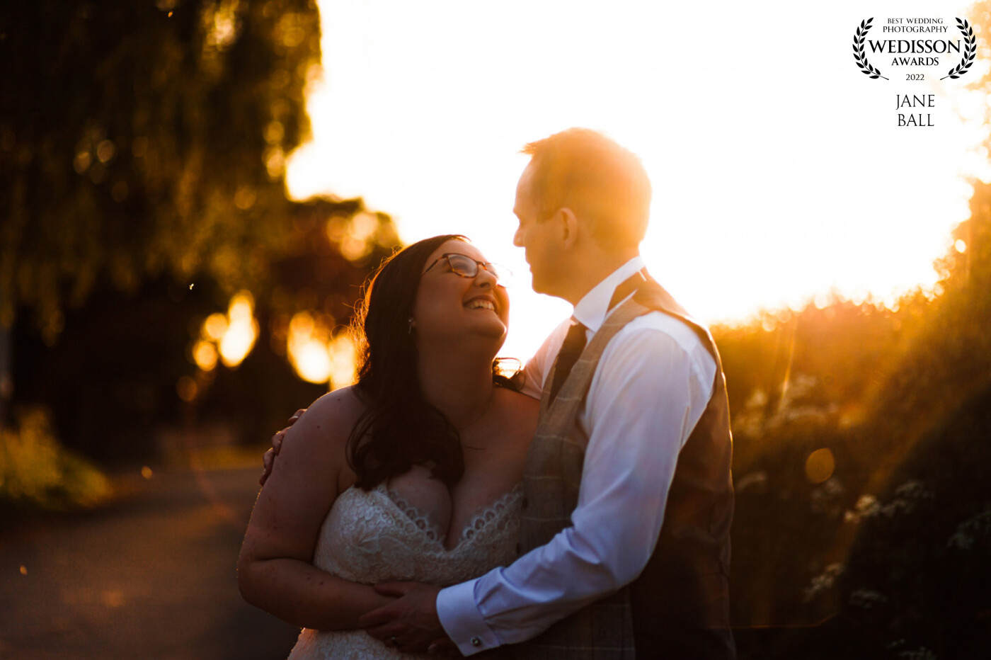 This is probably one of the best sunsets I've experienced as a wedding photographer. As soon as I saw the lane outside the venue I knew I had to get my couple out and into that beautiful warm light for their portraits. They were such a great fun loving couple we were out for ages and I got absolutely loads of gorgeous portraits of them just being them, enjoying some quiet time away from the crowd.