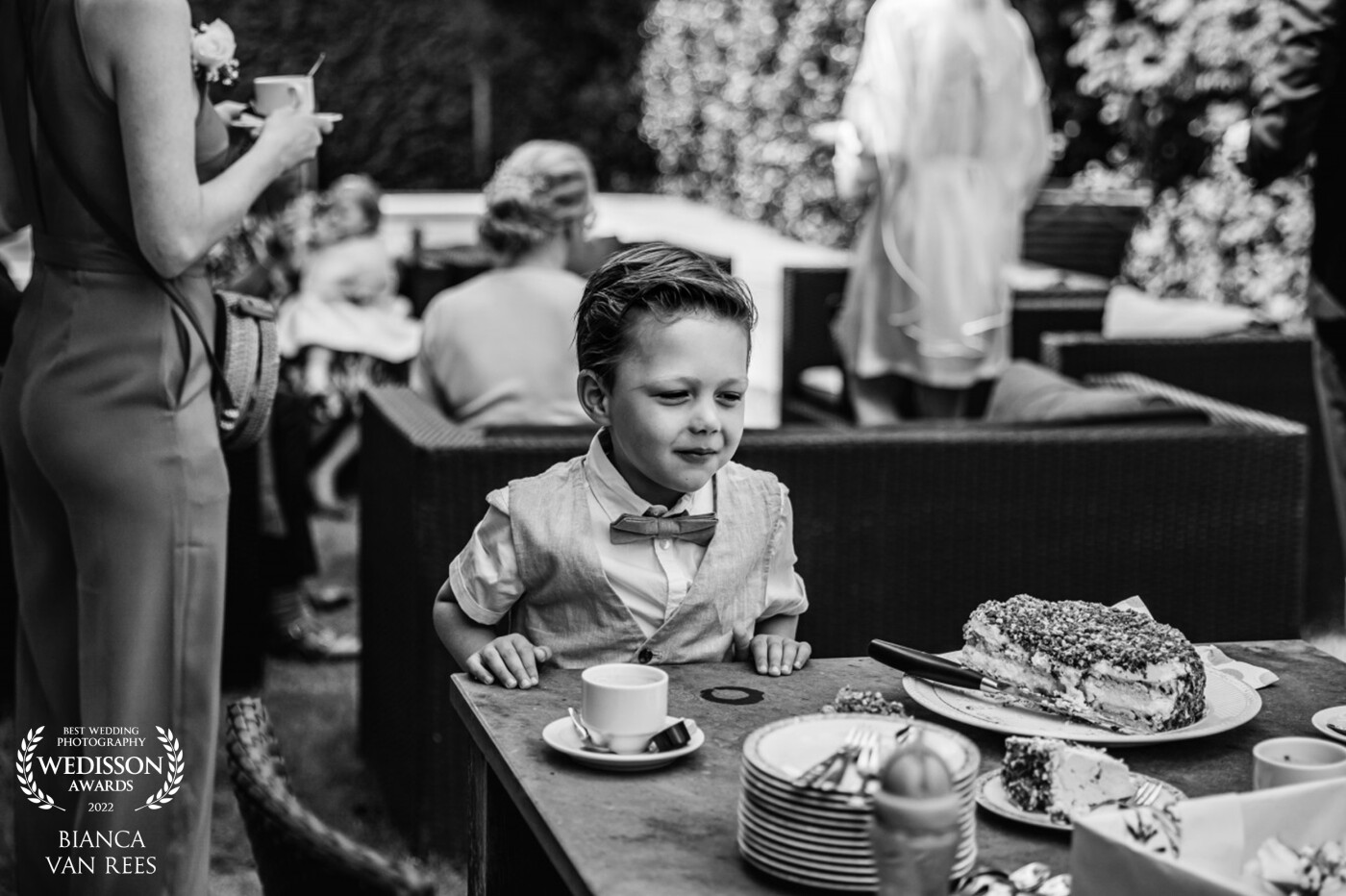 The look on this little mans face tells the entire story.  Staring down at this beautiful and tasty cake, who wouldn't want another piece of that wedding cake?