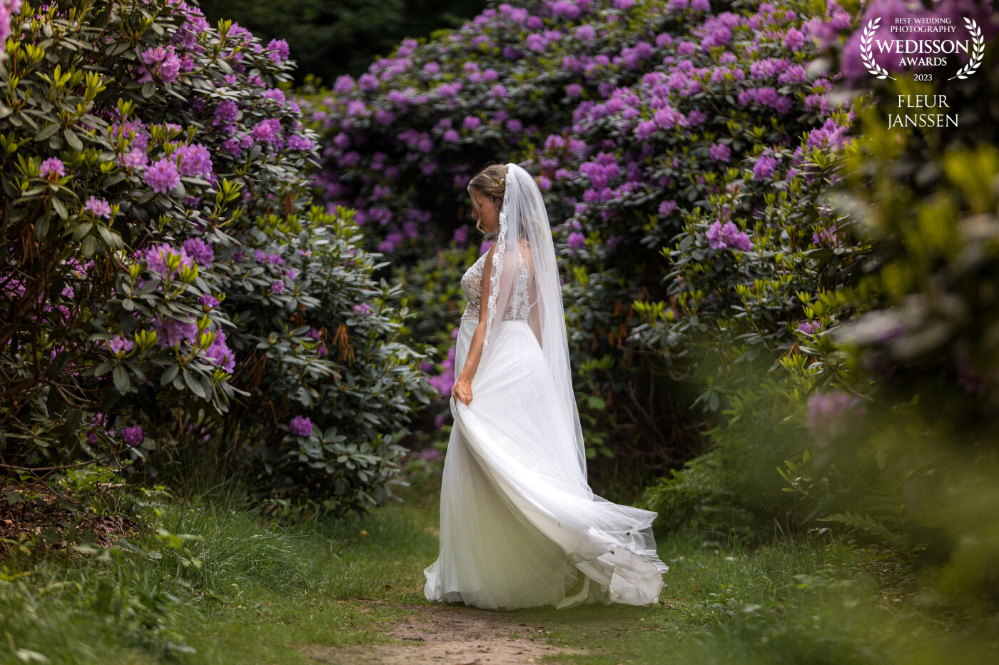 Lovely bride spinning around in the amazing garden of Oranjerie Groot Warnsborn.
