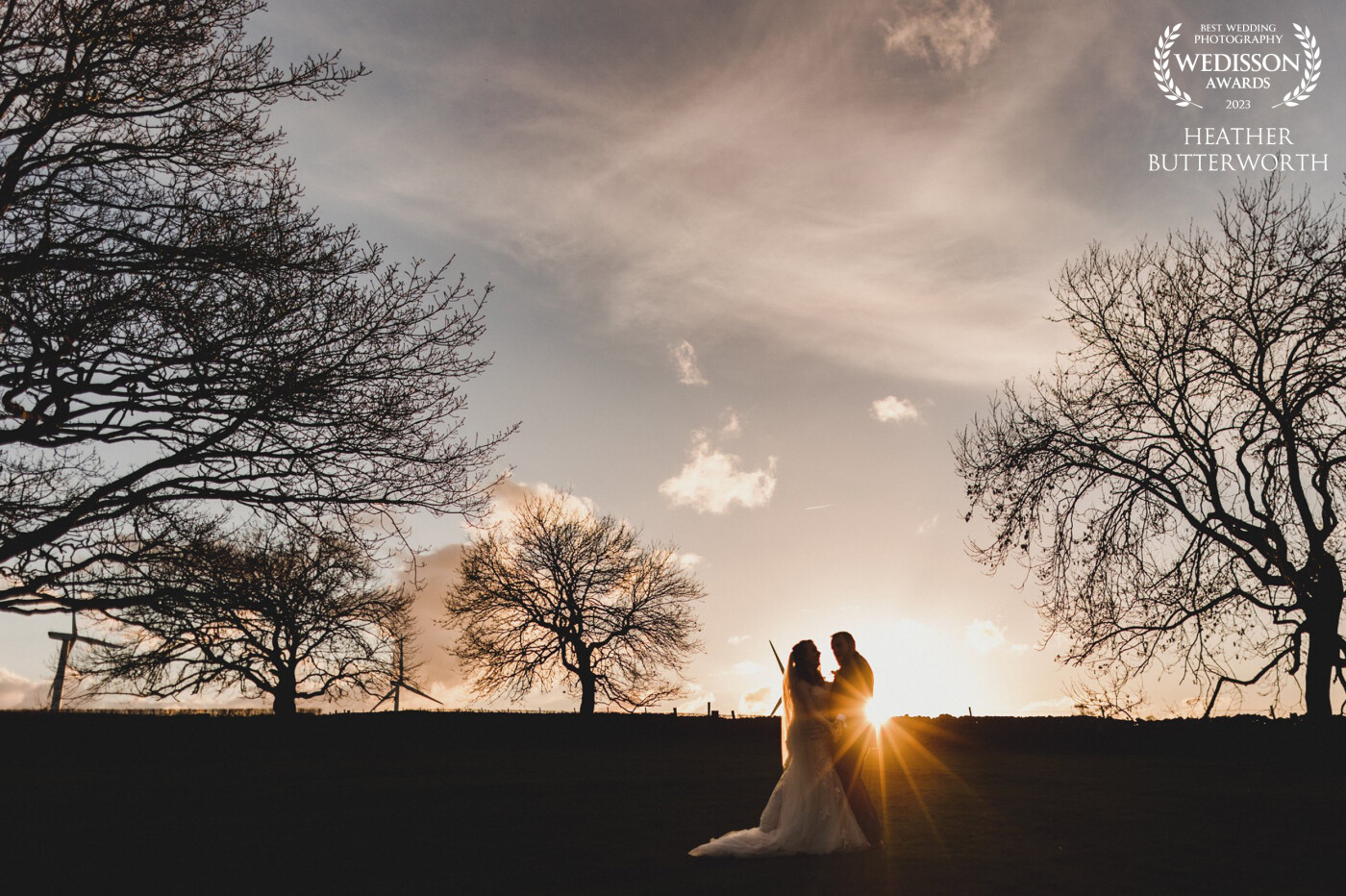 The sun was just starting to set so Hannah and Jason took at little walk through the field at Spicer Manor and I captured this beautiful photograph of them just before the sunset behind them. They then went happily back off to their puddings!