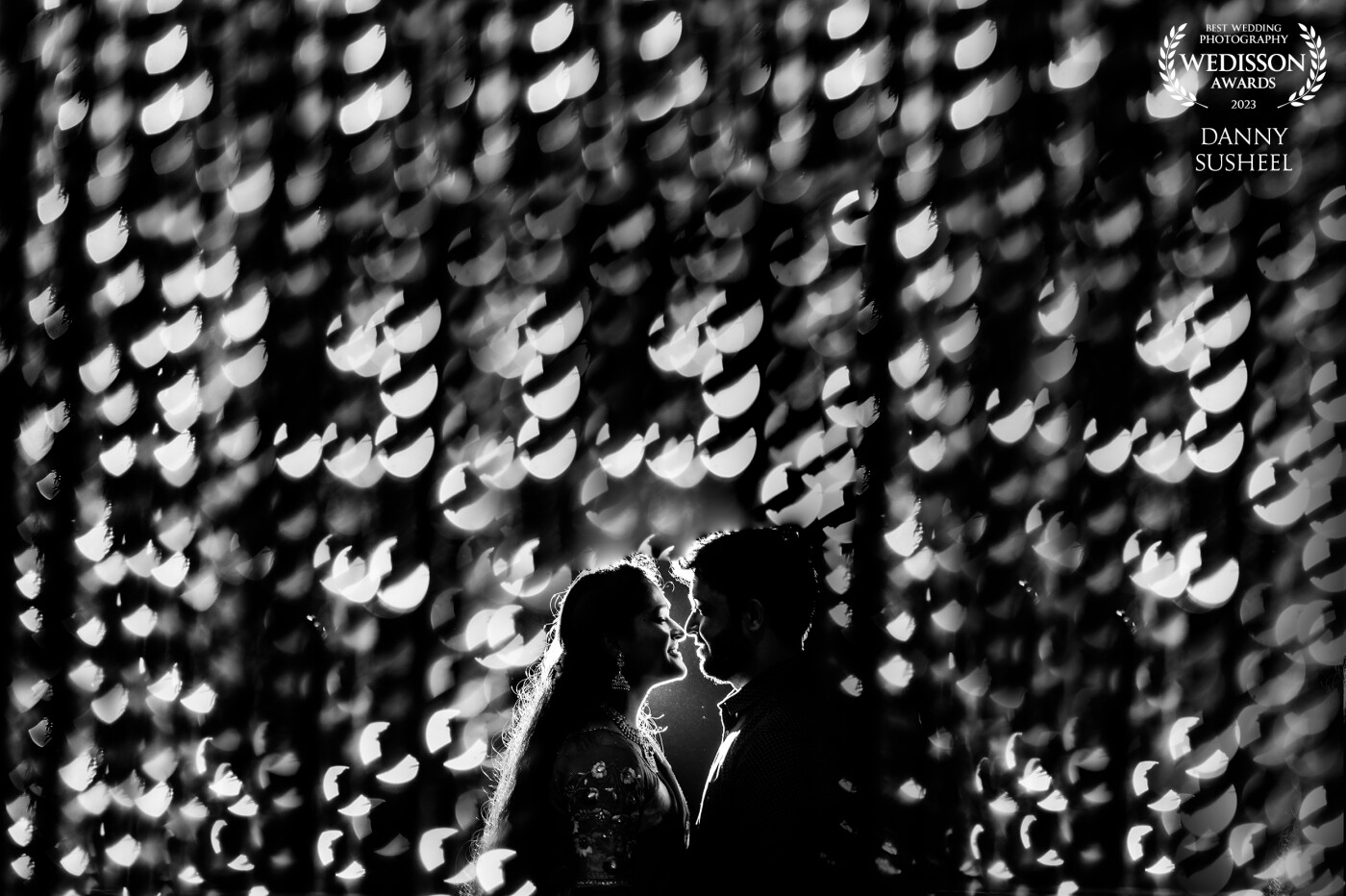 Amidst stunning bokeh, their noses unite in a magical moment where their hearts entwine and reveal pure affection.