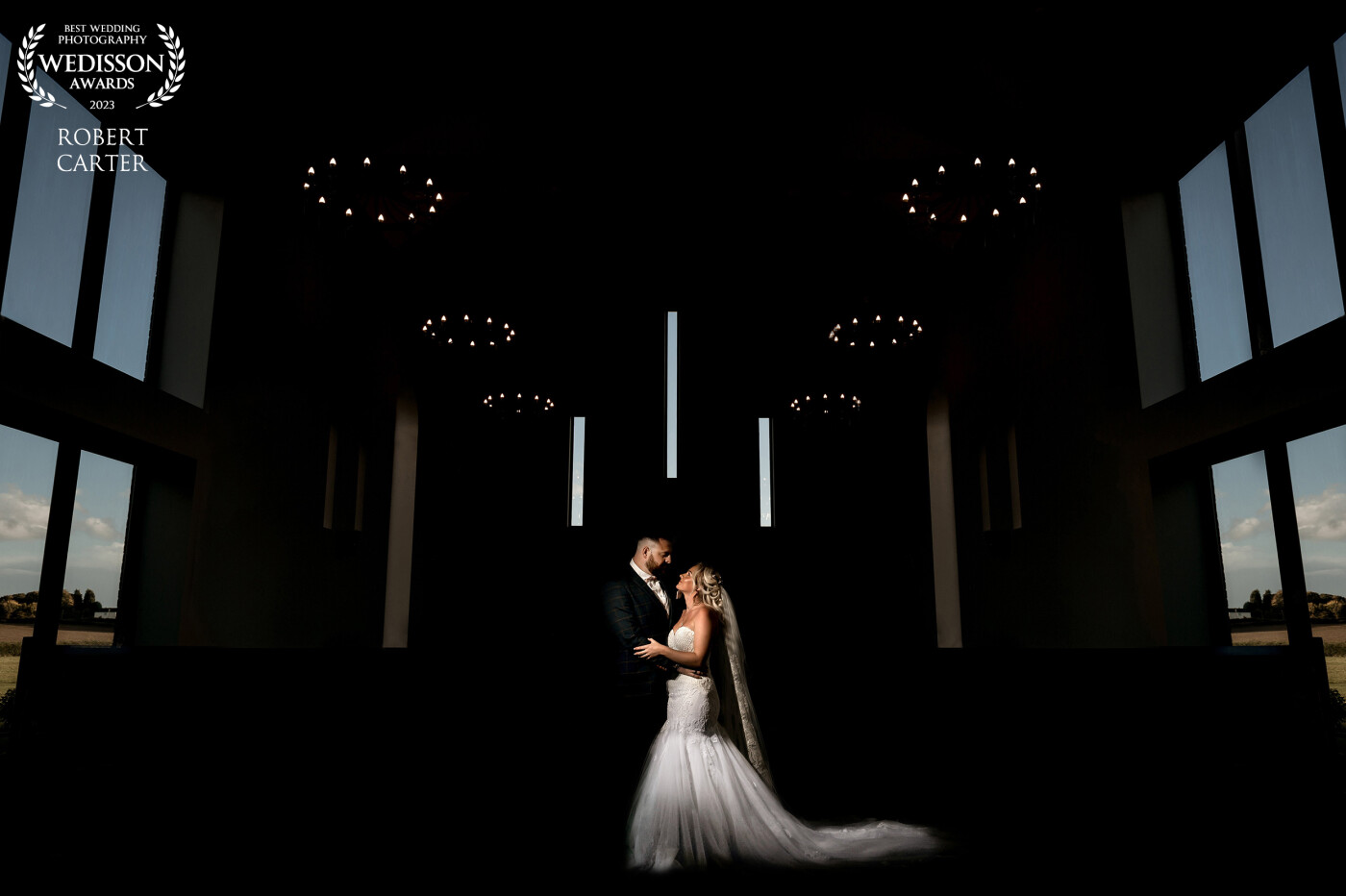 Bride and Groom inside the stunning Chapel at Burntwood Court. The Couple are lit by a zoomed flash.