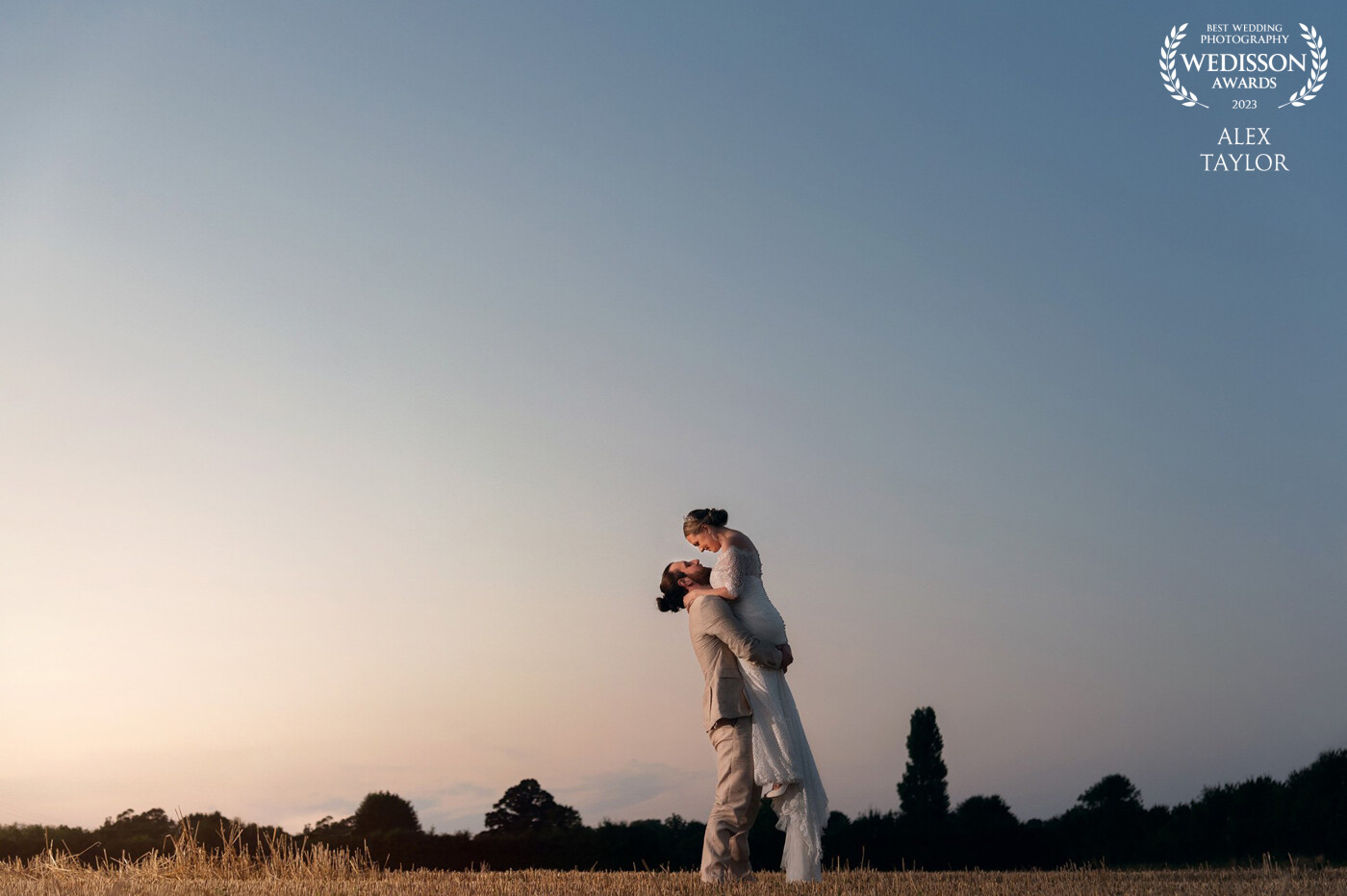 As the sun started to dip in the sky in the charming rural villiage of Cotton we headed out to a nearby field for a peaceful moment to catch the last of the rays. <br />
<br />
Ryan lifted his new wife Becky as they celebrated the start of their married life together.
