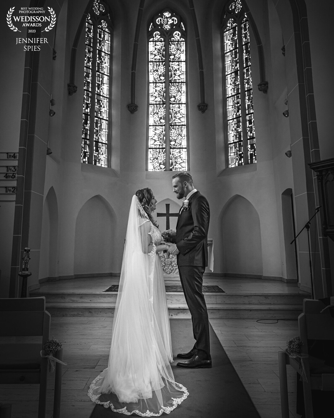 What an intimate moment between the bridal couple shortly after the wedding ceremony in this beautiful church.